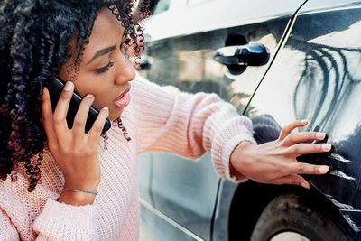Black Woman Feeling Sad After Scratching Her Auto — Trinidad, CO — Griego Insurance Agency