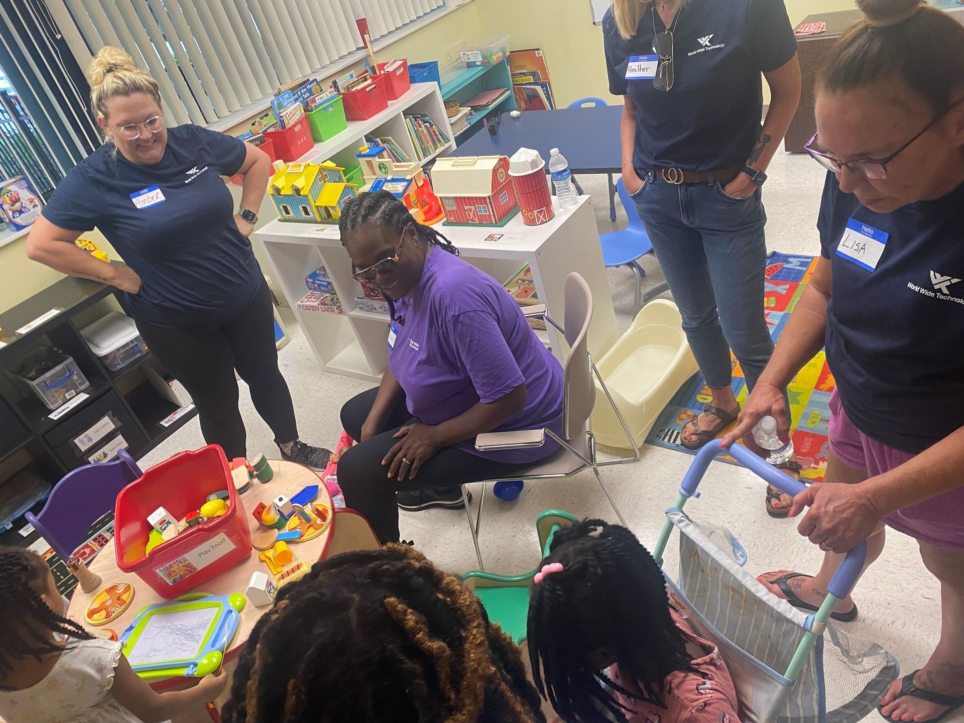 Lady on Purple Playing with Kids Toys | Bridgeton, MO | Room at the Inn