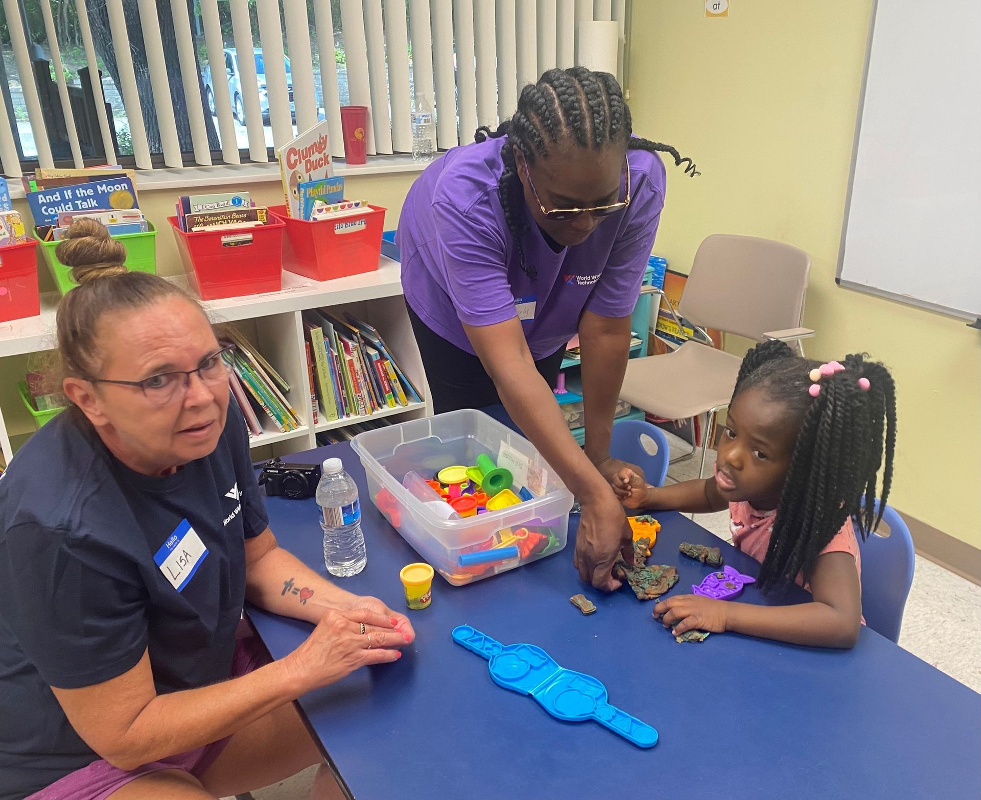 Two Women Playing Clays with The Little Girl | Bridgeton, MO | Room at the Inn