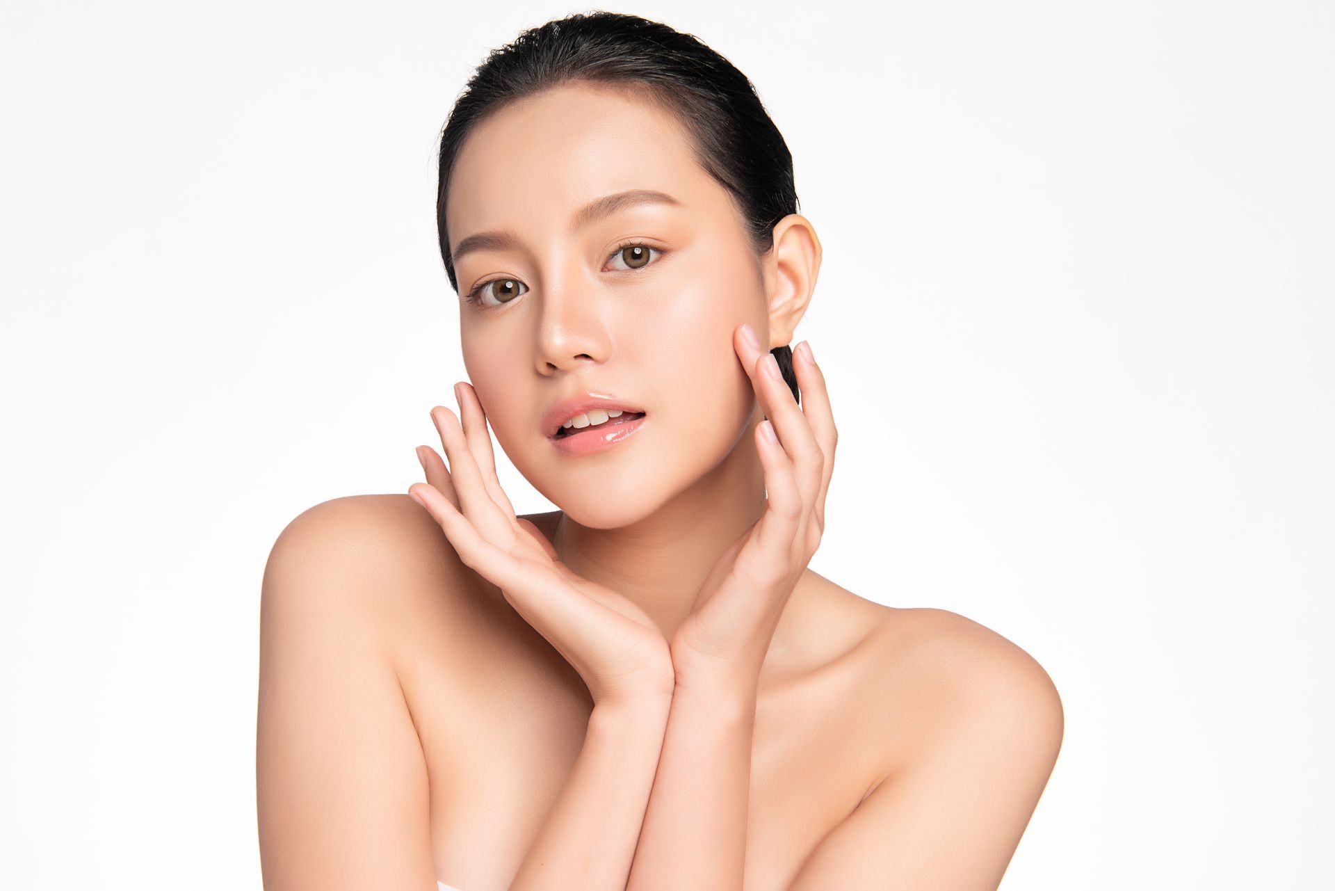 A woman showing her face after excel laser V