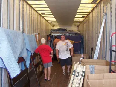A man in a red shirt with the word boston on it