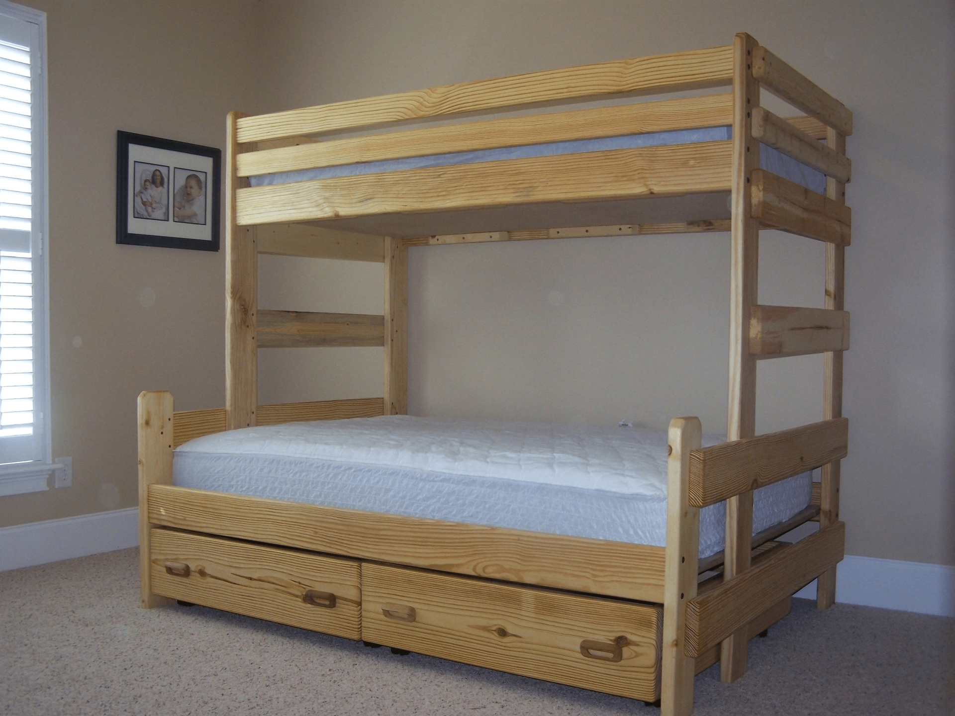 A wooden bunk bed with drawers underneath it in a bedroom