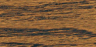 A close up of a piece of wood with a black stripe on it.