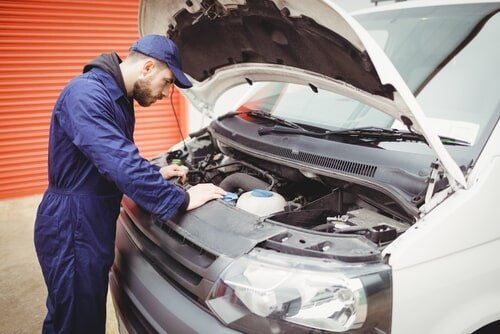 Mechanic in Blue Jumpsuit Checks  — Sparky's 4x4 Auto Electrical In Taminda, NSW