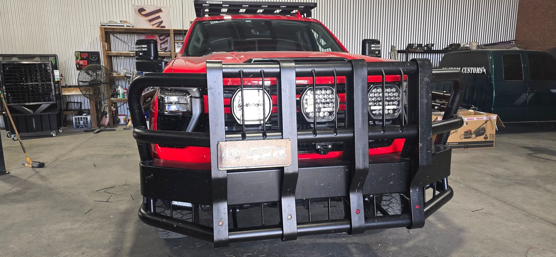 Red Truck with Black Bumper Guard, Inside a Garage — Sparky's 4x4 Auto Electrical In Taminda, NSW