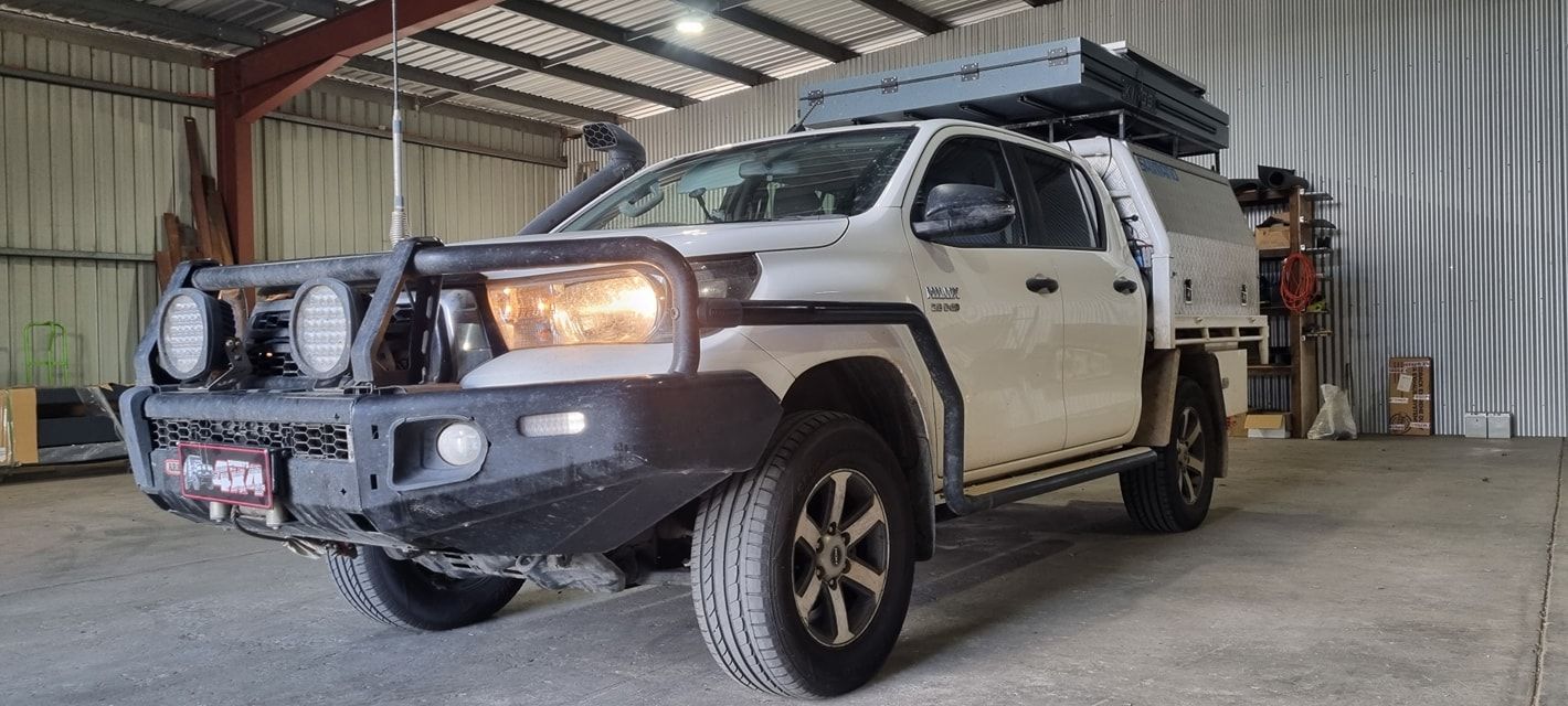 White Pickup Truck with Off-Road Accessories Parked Inside a Garage — Sparky's 4x4 Auto Electrical In Muswellbrook, NSW