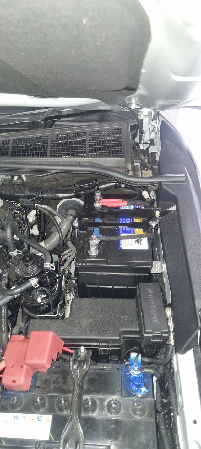 Car Engine Bay Showing the Battery, Fuse Boxes, and Engine Components — Sparky's 4x4 Auto Electrical In Muswellbrook, NSW
