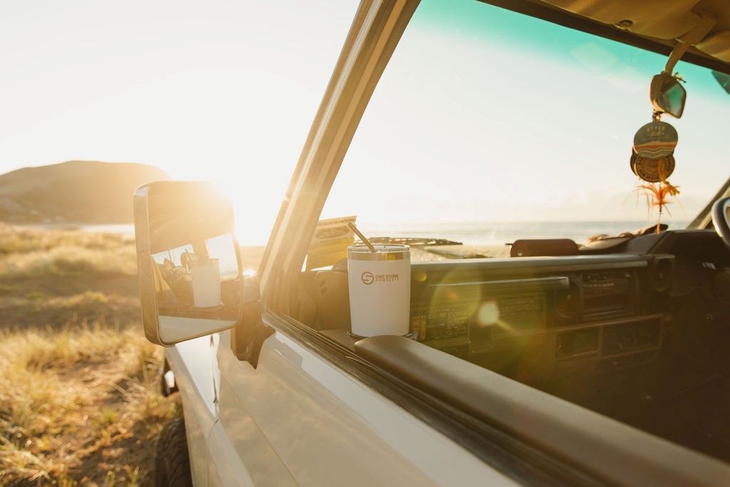 White Truck Parked Near Beach with A Drink on The Side — Sparky's 4x4 Auto Electrical In Muswellbrook, NSW