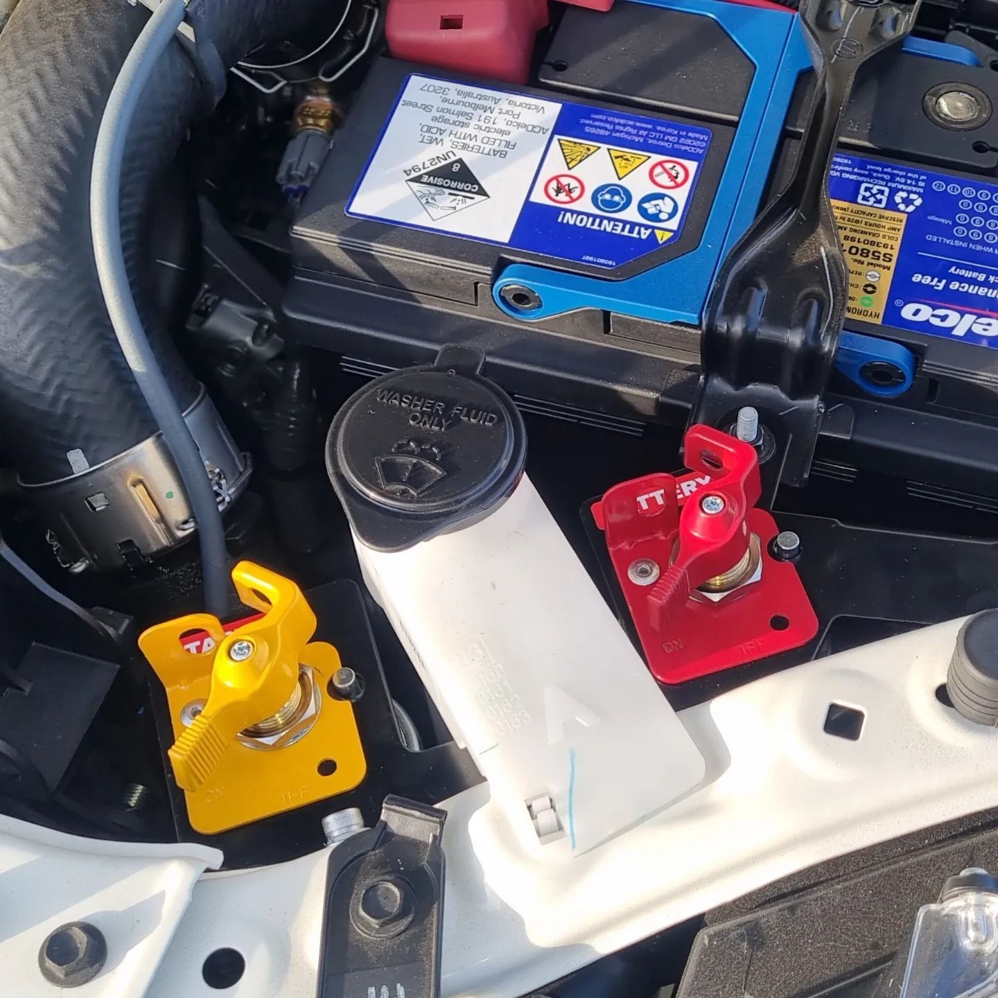 Car Engine Bay with Battery, Various Colored Clamps, and Fluid Reservoir — Sparky's 4x4 Auto Electrical In Taminda, NSW