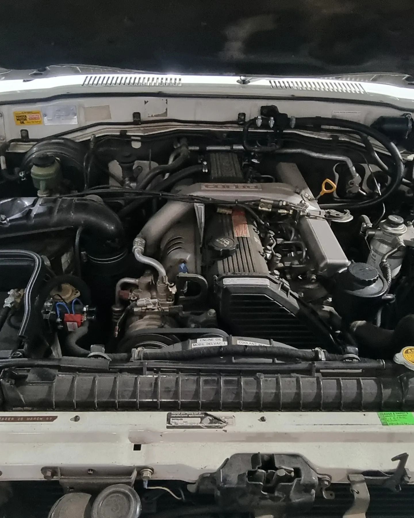 Engine of A White Vehicle, Viewed from Above, Showing Various Components — Sparky's 4x4 Auto Electrical In Taminda, NSW