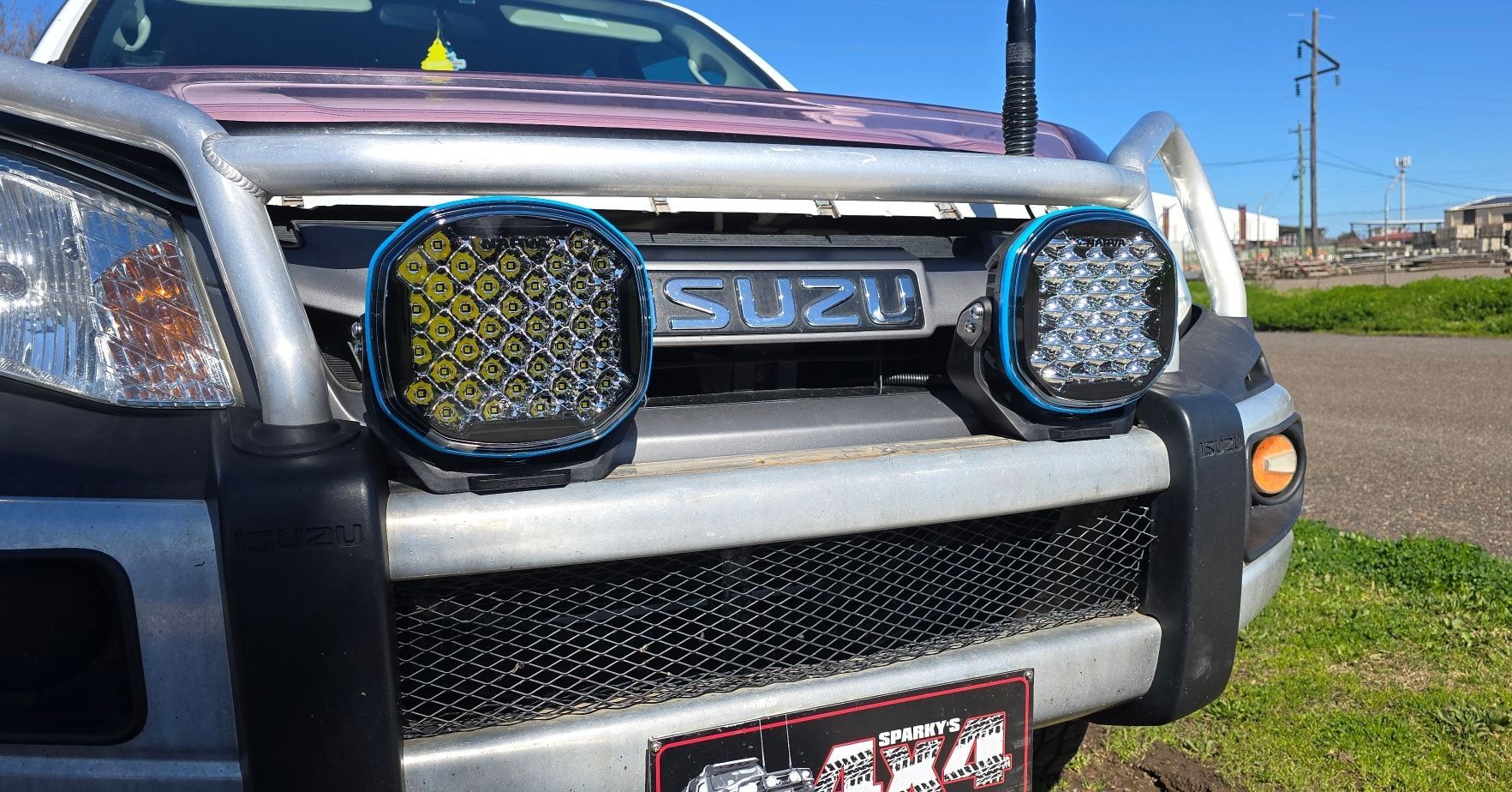 Silver Isuzu Truck with Spotlights on Front Bumper, Black Grill — Sparky's 4x4 Auto Electrical In Gunnedah, NSW