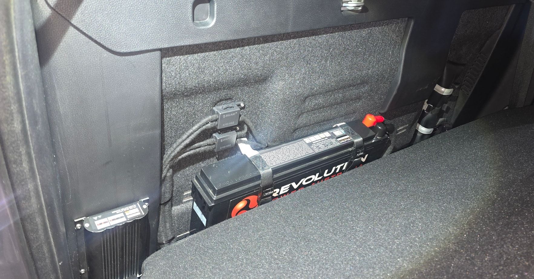 Black Revelum Lithium Battery Installed in A Vehicle — Sparky's 4x4 Auto Electrical In Taminda, NSW
