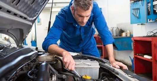 Mechanic Repairing Car