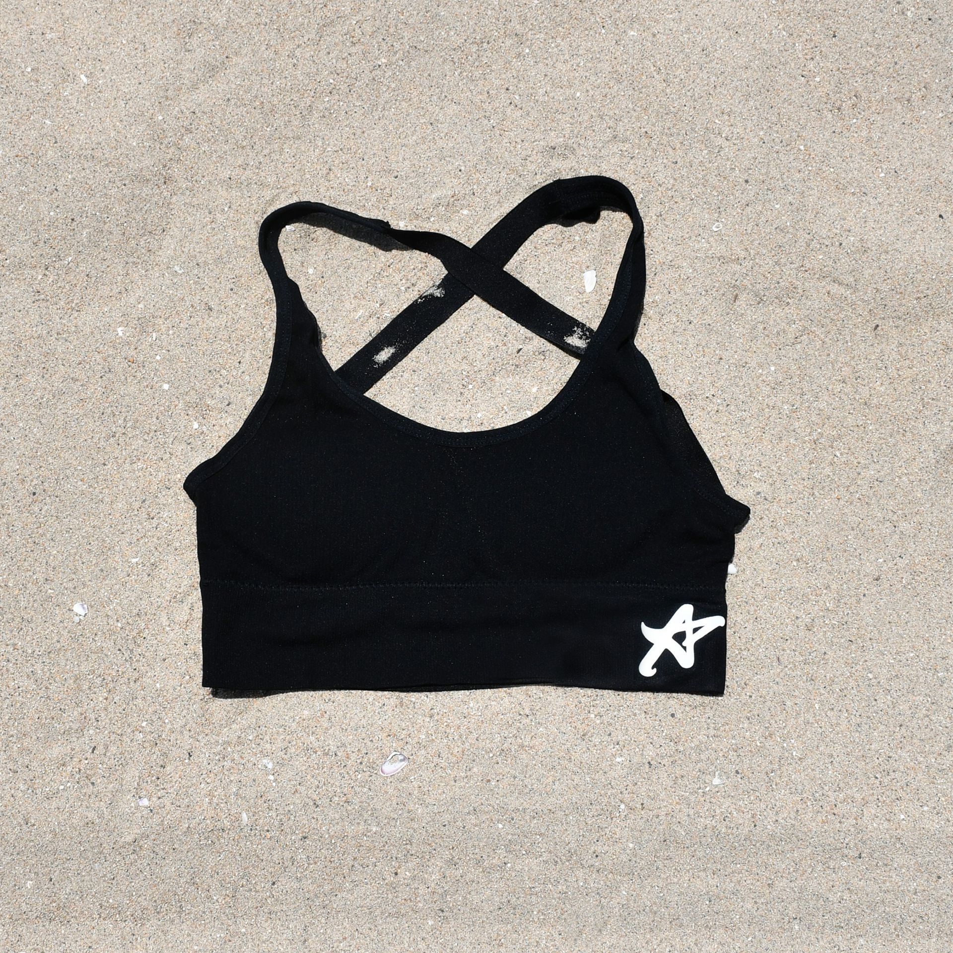 A black sports bra with a white star on it