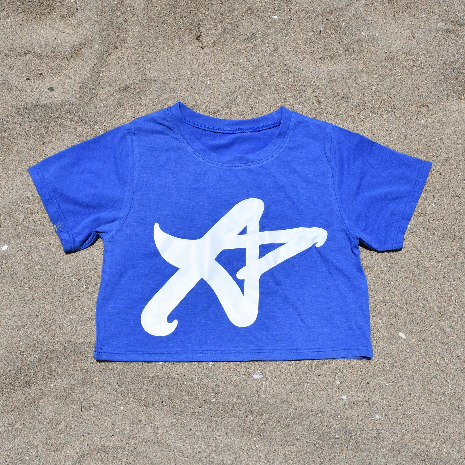 A blue shirt with a white starfish on it