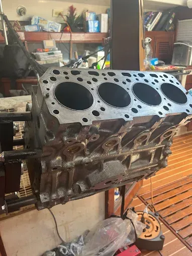 A pile of silver squares on a blue surface