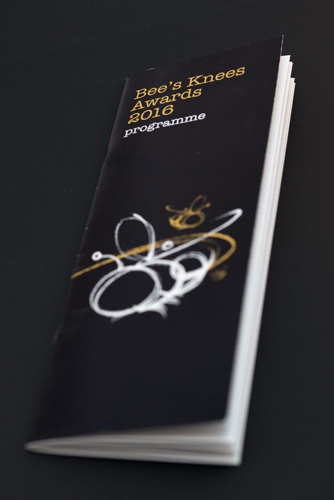 A black book titled bee 's knees awards 2016