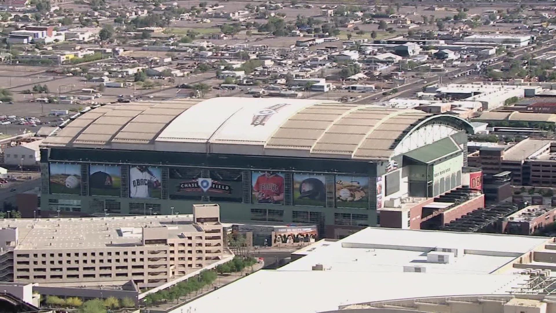 An aerial view of a large stadium in the middle of a city.