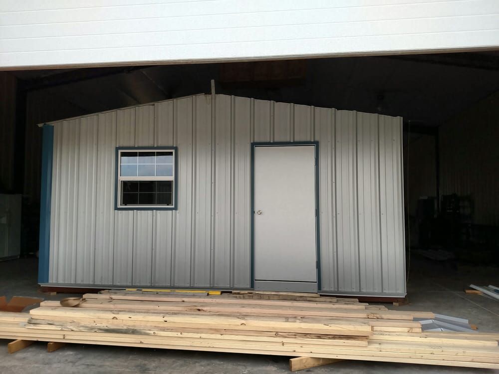 A metal building with a window and a door