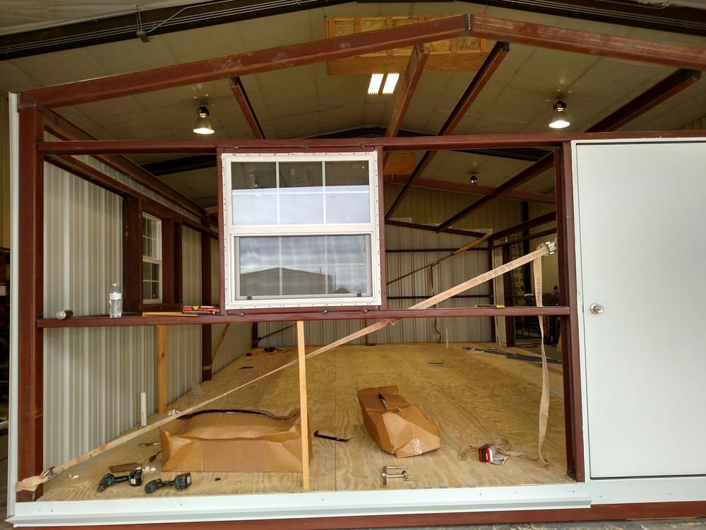 A building under construction with a window and a door