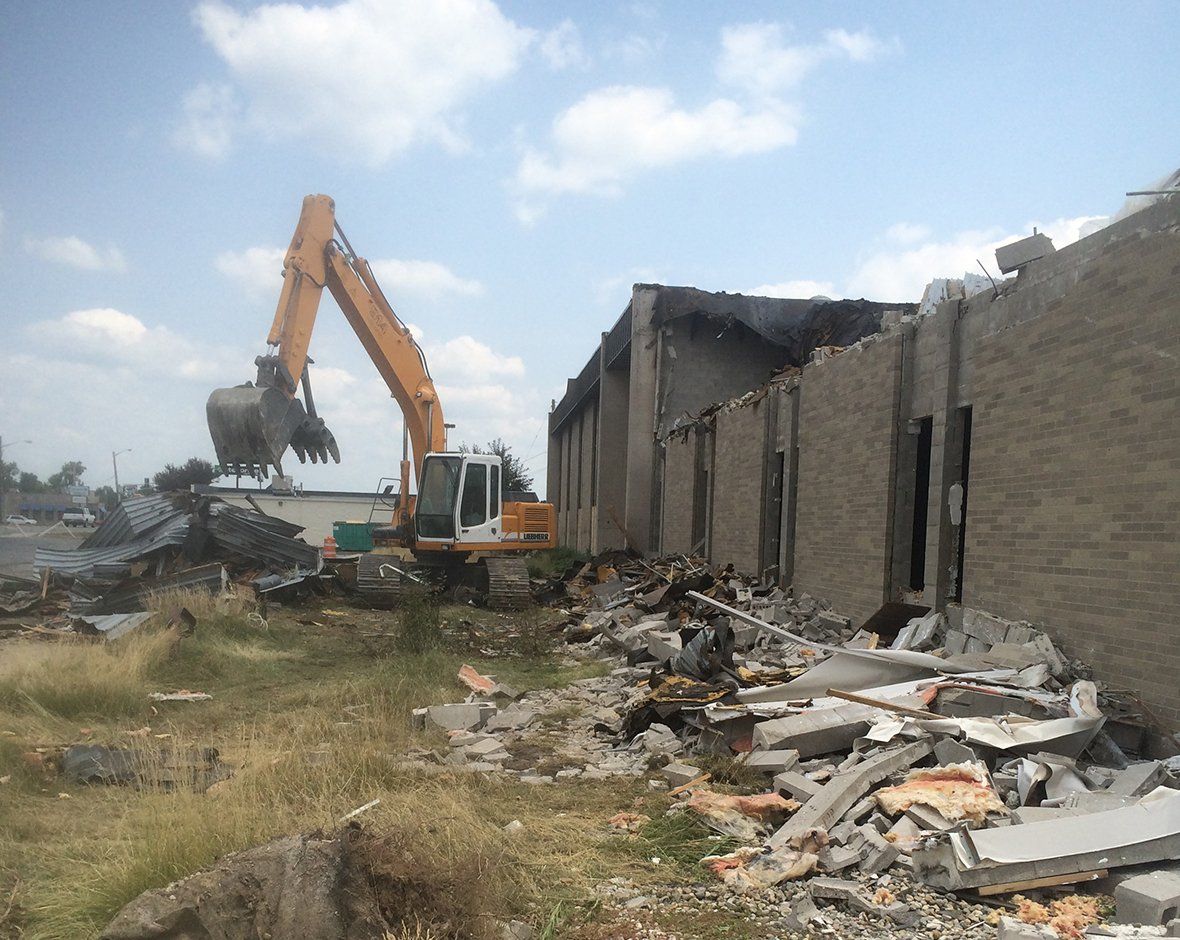 Demolishing Building Using Excavator — Fort Wayne, IN — Worx Companies