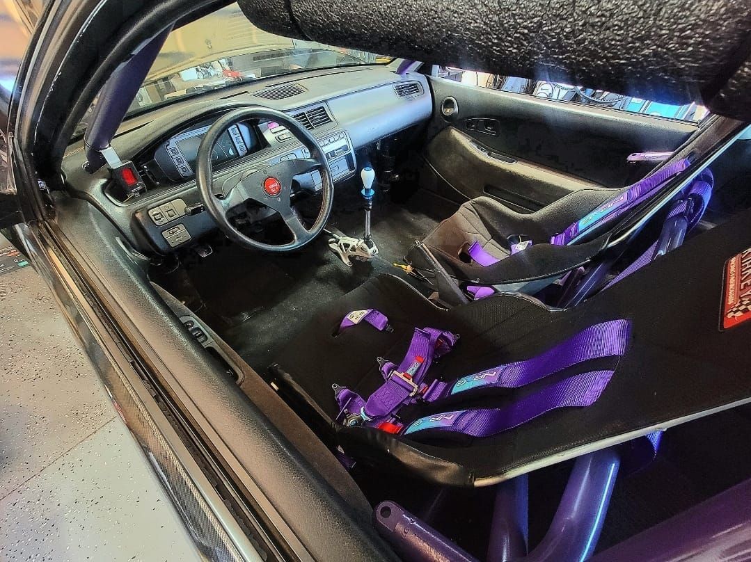 Interior View Of Racing Car With Roll Cage And Harness Seats | YTS Auto Repair