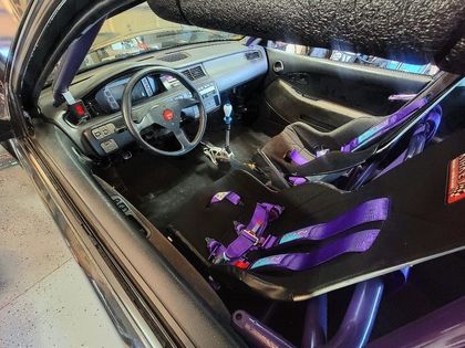 Interior View Of Racing Car With Roll Cage And Harness Seats | YTS Auto Repair