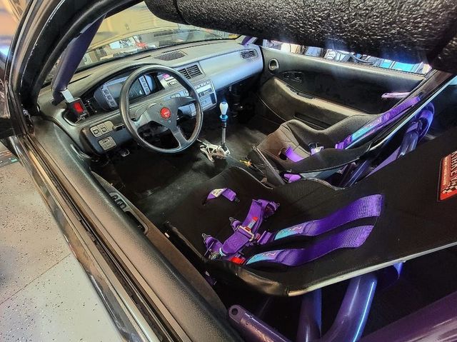 Interior View Of Racing Car With Roll Cage And Harness Seats | YTS Auto Repair
