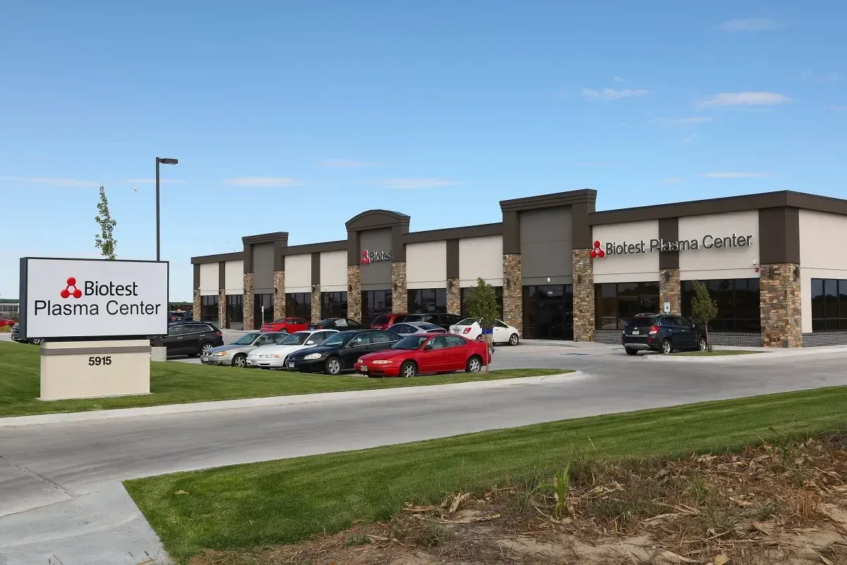 A large building with a sign that says alixtek pharma center