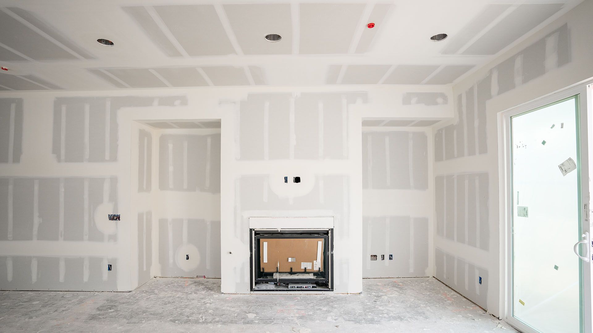 There is a fireplace in the middle of the room.