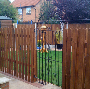 picket fencing and steel gate