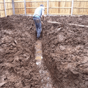 digging out trench for drainage