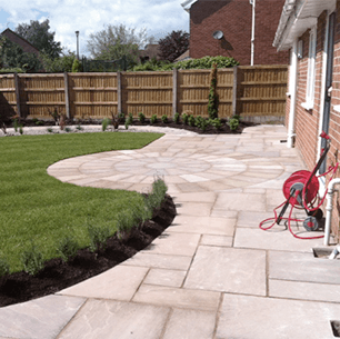 patio and turfed lawn with panel fencing
