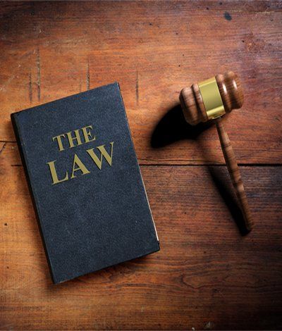 Law Book and Judge Gavel — Law Book and Judge Gavel on Wooden Background in San Diego, CA