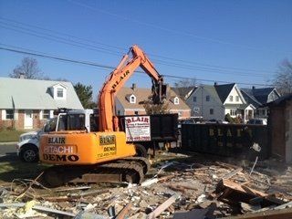 Home Cleanouts — Close-Up Of Excavator in Middletown, NJ