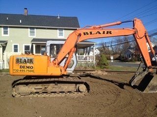 House Junk Removal — Excavator Removing Soil in Middletown, NJ