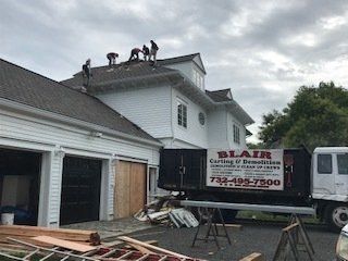 Trusted Demolition Company — Men On Top Of Roof in Middletown, NJ