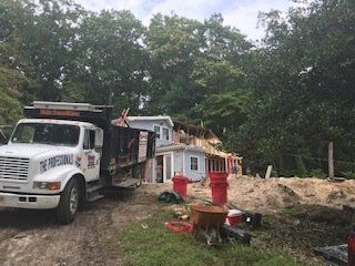 Carting & Demolition Services — House During Demolition in Middletown, NJ