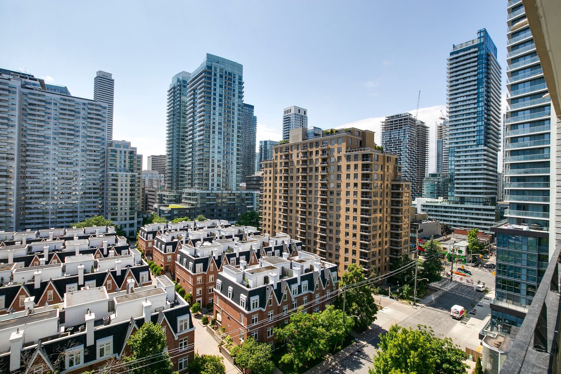 An aerial view of a city with lots of buildings and trees.