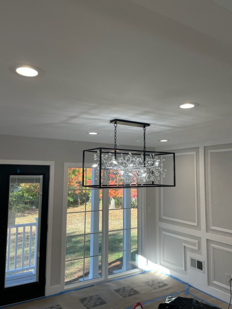 Solar panels on a building rooftop, generating electricity under a blue sky.