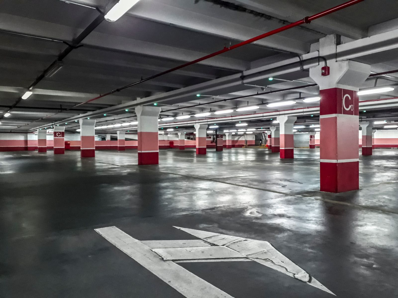 Electrical control panel with relays and wiring. Red, white, and orange wires connect components in a metal enclosure.