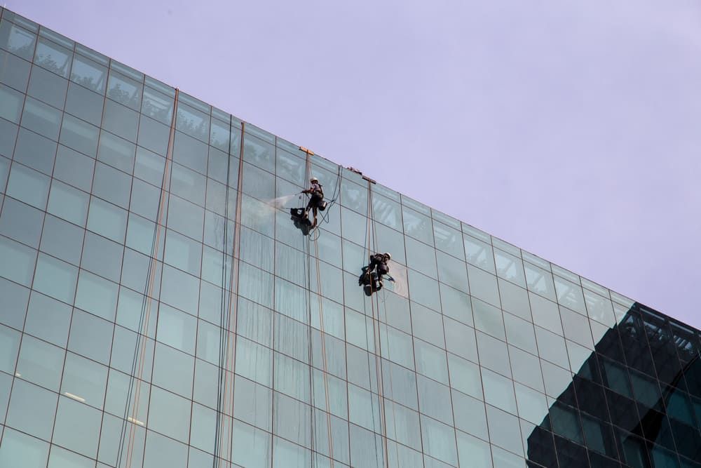 Two Men Doing Cleaning Glass After Glass Repair - Professional Glazier on Logan Village, QLD