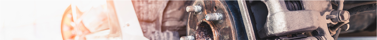 Blurred people in front of a vehicle. Warm colors and soft focus. | Deville Automotive