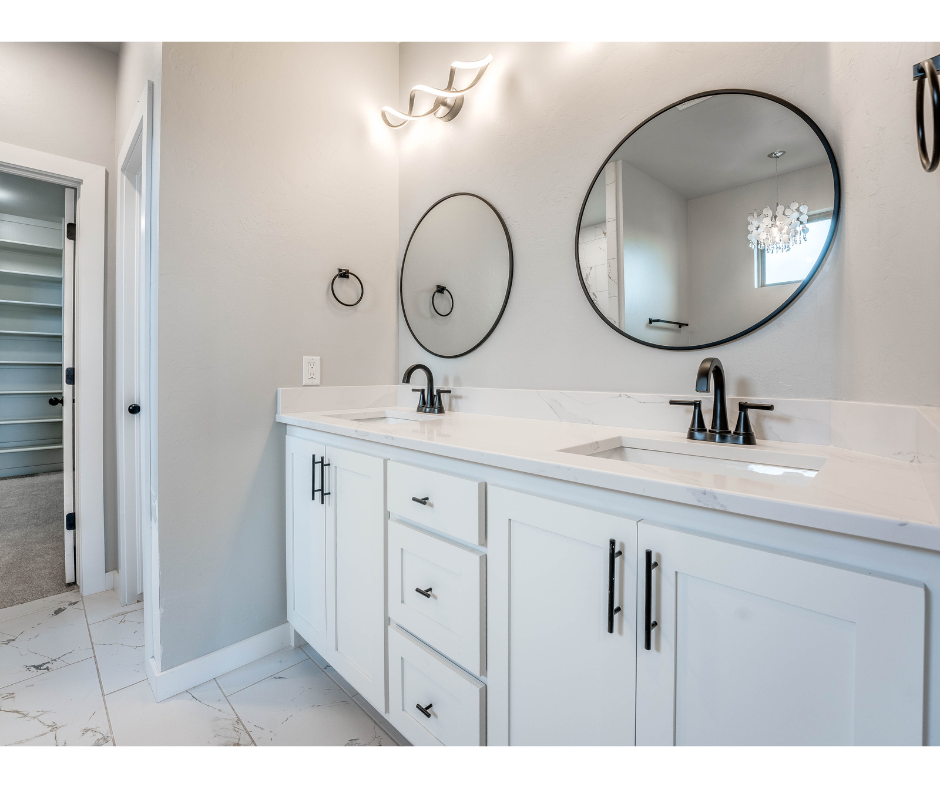 A bathroom with two sinks and two mirrors.