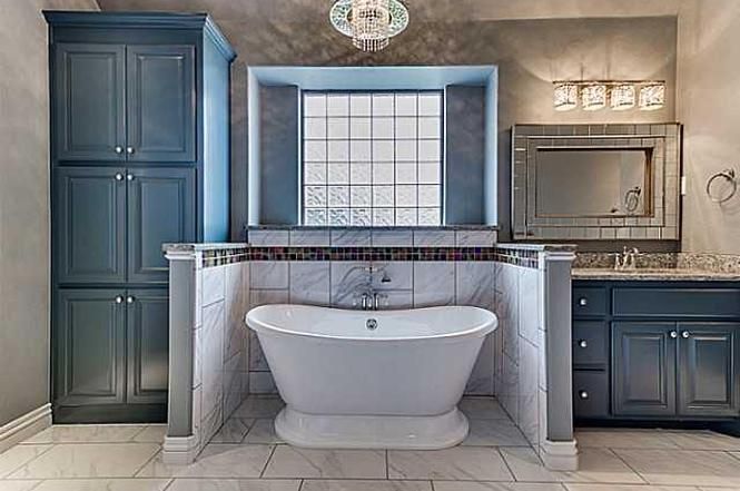 There is a bathtub in the middle of the bathroom.