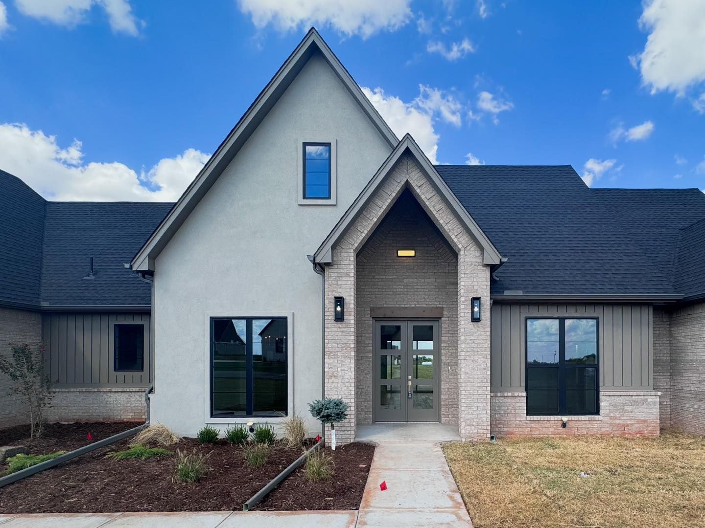 A large white house with a black roof