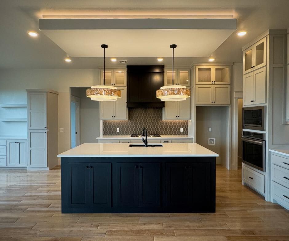 There is a large island in the middle of the kitchen.