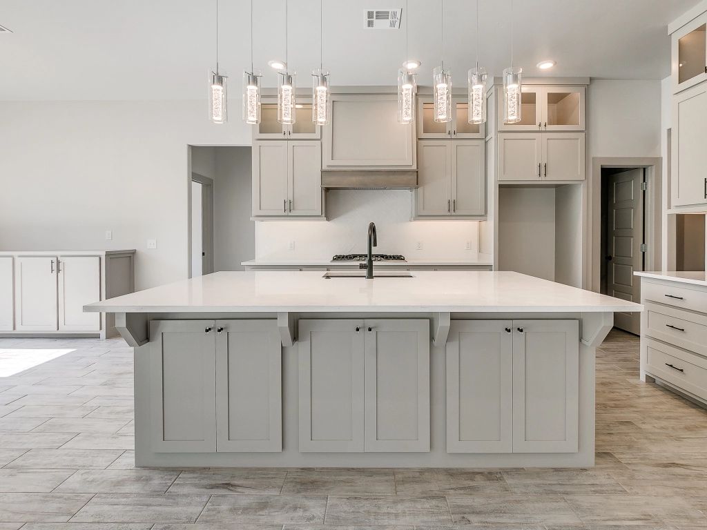 There is a large island in the middle of the kitchen.