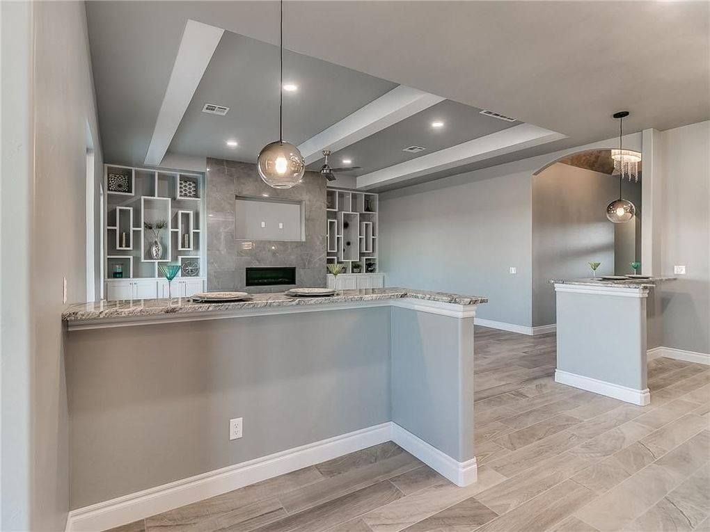 A kitchen with a large island in the middle of the room.