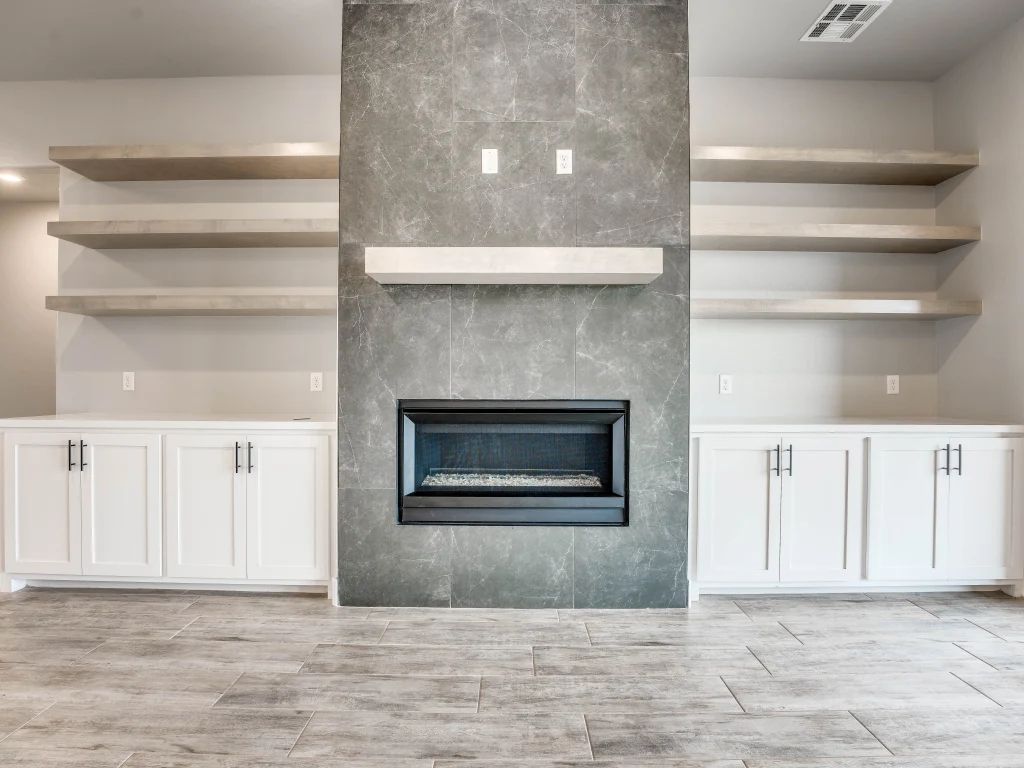 There is a fireplace in the middle of the room.